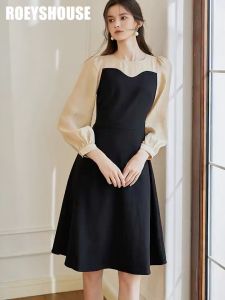 Đầm đen xoè phối tay kem dài cổ kiểu