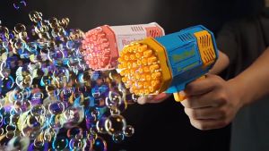 ฟองปืนเป่าฟอง เครื่อง เป่าฟอง ปืนยิงบับเบิ้ลลาย 69 รู มีไฟ ชาร์จ US