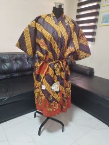 Batik robe with yellow and blue patterns tied waist fits regular body to 2XL size. 26" overlap x 42" high. Made in Indonesia