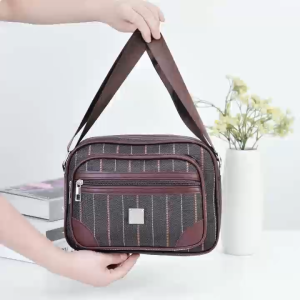 KENBAGS#8742 Crossbosy Women`s bag eatures a multi-zippered design with a striped canvas body and leather accents.
