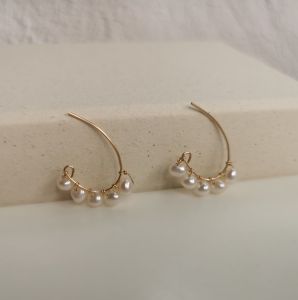 DaVee 14K gold filled freshwater pearl earrings with curved design and multiple pearls.