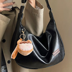 กระเป๋าสะพายข้างหนังนิ่มแบบลำลองสำหรับผู้หญิง กระเป๋าเดินทางทรงจี้สีขาวสไตล์ใหม่ปี 2025 กระเป๋าสะพายข้างทรงกลมขนาดใหญ่