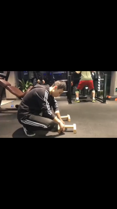 A pair of oak prone push-up bars heavy parallel bars - used for muscle rise training and cross-fit