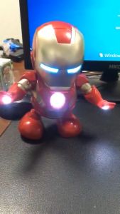 The dancing robot superhero Hulk has an electric walking toy of light and sound as a birthday present for children