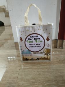 Tas Hampers Idul Fitri Kombinasi Mika Bening + Banner Printing Ukuran Tas 25x30x10