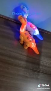 Đồ chơi mô hình khủng long dùng pin biết đi có đèn và nhạc- Chất liệu nhựa ABS an toàn Musical Toy