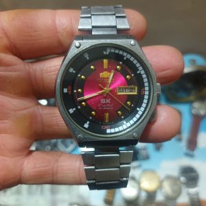 Đồng hồ SK mặt đỏ lửa zin cổ  đời trung sưu tầm nguyên Zin