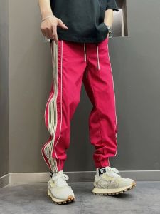 กางเกงทำงานลำลองชาย ทรงหลวม ผ้ายืด ระบายอากาศได้ดี กางเกงขายาวทรงสปอร์ตแบบมีแถบ กางเกงขายาวลำลองแฟชั่นฤดูใบไม้ร่วง