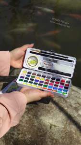 MEEDEN Travel Watercolor Paint Set: 50 Colors Watercolor Paints for Beginner with Brushes & Concertina Coloring Book - Portable Water Color Kit for Adult Painting On the Go
