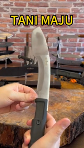TANI MAJU Agriculture knives with black handles and silver blades displayed on wooden surface.