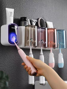 Ecoco Modern Minimalist Wall-Mounted Toothbrush Holder No-Drilling Toothpaste Cup Storage Rack Bathroom Organization Tool