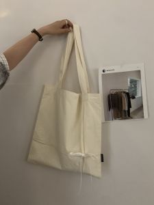 กระเป๋าผ้าขาวแบบมีฮู้ดแบบพับ กระเป๋าสะพายไหล่ข้างเดียว Pure White High Cotton ดีไซน์ผูกโบว์ผีเสื้อ กระเป๋าสะพายประจำวันสำหรับเยาวชนและวัยกลางคน