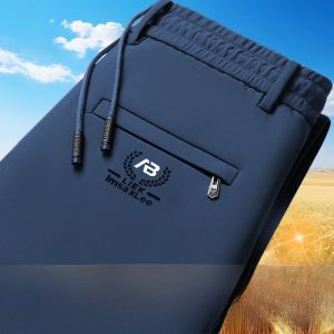 กางเกงขายาวทรงตรงผ้าไหมน้ำแข็งสำหรับผู้ชาย กางเกงขายาวลำลองฤดูร้อน กางเกงขายาวทรงตรงบางสำหรับทำงาน กระเป๋าซิป ทรงหลวม