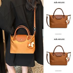 กระเป๋าผ้าใบทรงขนมจีนขนาดใหญ่สำหรับผู้หญิง กระเป๋าสะพายข้างแบบลำลอง กระเป๋าถือแบบสะพายไหล่ข้างเดียว กระเป๋าผ้าใบสีน้ำตาล กระเป๋าแฟชั่น