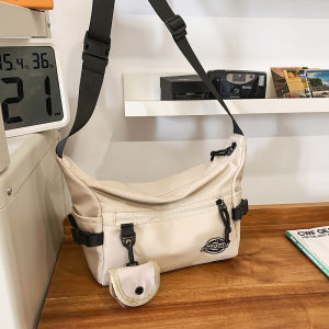 กระเป๋าสะพายข้างผ้าไนลอนทรงสี่เหลี่ยมกลวงแบบลำลองสำหรับใส่ไปเรียน สำหรับผู้ชายและผู้หญิง กระเป๋าสะพายข้างแบบสะพายข้างสำหรับเดินทางขนาดใหญ่แบบน้ำหนักเบา