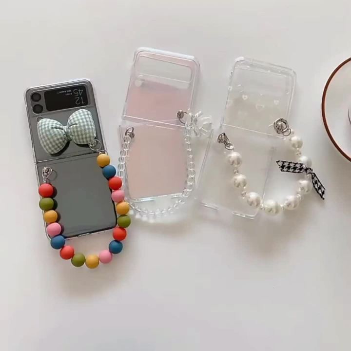 Omio for Galaxy Z Flip 4 Cute Case, Clear Holographic Heart Phone Case with Pearl Chain Bracelet Wrist Strap for Women Girls Aesthetic Glitter Rainbow Slim Shockproof Hard PC Cover
