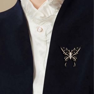 Bros kupu warna Hitam asesoris pakean