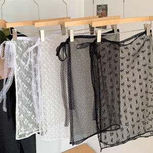 The lace dress with a curtain cover creates a layered look when paired with an apron a half skirt and a sheer floral pattern