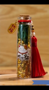 Feng Shui Bottle With Red Tassel With Chinese Charms And Tassels For Good Fortune And Prosperity.