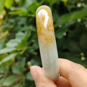 57.7 mm Crafted as Peace bangle on Burmese with light green hue and brown Natural Type A Jadeite Jade certificate weighs 60.36 grams Width 14mm Thickness 7.5mm (bangle17)