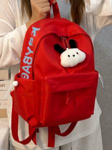 Red Lightweight Small Backpack for Women College Students Dual Shoulder Bag Nylon Material Zipper Closure School Scene