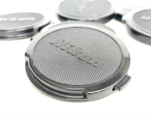 ฝาปิดหน้าเลนส์ ยี่ห้อ Nikon 52 mm Lens Cap  Genuine Vintage Nikon Cap lotสภาพดี made in japan
