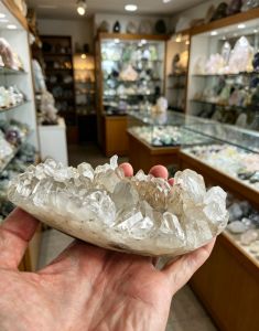 Crystal raw stone crystal clear quartz with a shape of a boat