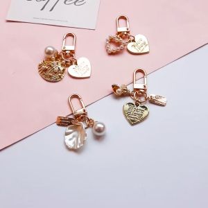 OHO พวงกุญแจโลหะ ประดับจี้รูปหอยและมูก กระดูกระชับ กับเครื่องประดับนี้ รวมเป็นเครื่องทำด้วยความสามารถ ของ OHO พวงกุญแจ