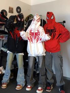 เสื้อสเวตเตอร์มีฮู้ดแบบหลวมๆ สำหรับผู้ชายและผู้หญิง ฤดูใบไม้ผลิและฤดูใบไม้ร่วง แจ็คเก็ตคาร์ดิแกนแบบเปิดหลวมๆ พร้อมซิปและลายแมงมุม