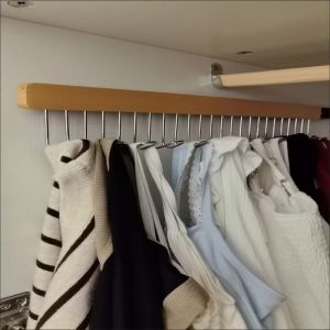 1 heavy-duty metal pull-out sliding wardrobe organizer with hooks and slides for easy organization of wardrobes and cabinets