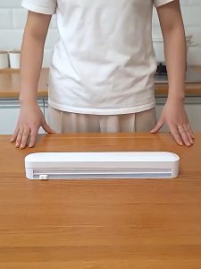 Plastic Wrap Dispenser with Slide Cutter Fixing Food Wrap Suction Cup Wrapping Cling Film Storage Cutting Box Holder