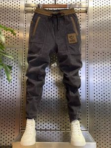 กางเกงลำลองผู้ชายหล่อเท่ฮิตในเน็ตกางเกงจั๊มข้อเท้าผ้าลูกฟูกเข้ารูปแบบใหม่ฤดูใบไม้ผลิและฤดูใบไม้ร่วงกางเกงกีฬาฮาเร็มเก้าส่วนแบบผู้ชาย