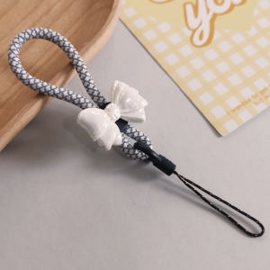 สายรัดโทรศัพท์ผูกโบว์ผีเสื้อถักแข็งแกร่งสำหรับนักเรียน สายรัดโทรศัพท์แบบสั้นสำหรับผู้ชายและผู้หญิง สายรัดโทรศัพท์แบบ U Disk สายรัดกล้อง CCD สายรัดโทรศัพท์แบบถัก