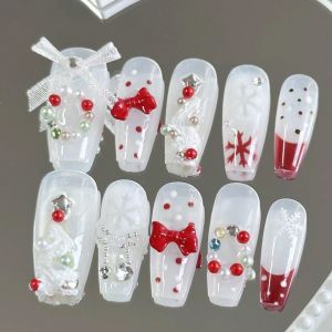 เล็บปลอมรูปโลงศพทำมือ 10 ชิ้น เล็บปลอมสวยงาม ลายโบว์คริสต์มาสสีแดงและสีขาว เหมาะสำหรับผู้หญิงที่ต้องการใช้