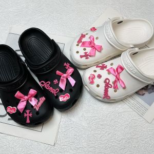 9Pcs/Set Crocs Jibbitz Charms Cool Barbie Spicy Girl Shoe Buckle Set Detachable Shoe Flower Decoration for Crocs\\n\\n Introduction to Crocs Jibbitz Charms\\n\\nCrocs Jibbitz Charms are small, colorful accessories designed to enhance the aesthetics of Crocs shoes. These charms come in various shapes, sizes, and designs, allowing users to personalize their Crocs to match their unique style.\\n\\n What Are Crocs Jibbitz Charms?\\n\\nCrocs Jibbitz Charms are small, round, or square-shaped accessories made from non-toxic PVC material. They can be easily attached to the holes on the surface of Crocs shoes, creating a fun and stylish look. Each charm features a unique design, such as animals, flowers, or patterns, allowing users to mix and match to create their desired aesthetic.\\n\\n Key Features of Crocs Jibbitz Charms\\n\\n- Made from non-toxic PVC material, ensuring safety for users of all ages\\n- Compatible with most Crocs shoes, providing versatility in customization\\n- Easy to attach and detach, allowing for endless customization possibilities\\n- Available in various designs, enabling users to express their unique style\\n\\n How to Use Crocs Jibbitz Charms\\n\\nAttaching Crocs Jibbitz Charms to your shoes is simple and straightforward. Follow these steps to customize your Crocs:\\n\\n Step-by-Step Guide to Attaching Charms\\n\\n1. Choose the desired charm design and color.\\n2. Locate the holes on the surface of your Crocs shoes.\\n3. Insert the charm into the hole, ensuring it is securely attached.\\n4. Repeat steps 1-3 until your Crocs are customized to your liking.\\n\\n Tips for Customizing Your Crocs\\n\\n- Mix and match different charm designs and colors to create a unique look.\\n- Experiment with different patterns and arrangements to find your preferred style.\\n- Regularly change your charms to keep your Crocs looking fresh and new.\\n\\n Benefits of Using Crocs Jibbitz Charms\\n\\nCrocs Jibbitz Charms offer several benefits, including enhancing the aesthetics of your Crocs and personalizing them to match your unique style.\\n\\n Enhance Your Crocs' Aesthetics\\n\\nBy attaching Crocs Jibbitz Charms to your shoes, you can transform their appearance, making them more visually appealing and unique. These charms add a pop of color and personality to your Crocs, making them stand out in a crowd.\\n\\n Personalize Your Crocs\\n\\nCrocs Jibbitz Charms allow you to express your individuality by customizing your Crocs to match your personal style. Whether you prefer a bold and colorful look or a subtle and elegant design, these charms provide endless customization possibilities.\\n\\n Detachable Shoe Buckles & Flower Decoration\\n\\nIn addition to Crocs Jibbitz Charms, this product includes detachable shoe buckles and flower decorations, further enhancing the customization options for your Crocs.\\n\\n Adding Unique Touches to Your Crocs\\n\\nThe detachable shoe buckles and flower decorations included in this product offer a unique way to personalize your Crocs. These accessories can be easily attached and detached, allowing you to experiment with different looks and styles.\\n\\n How to Detach Shoe Buckles\\n\\nDetaching shoe buckles is simple and straightforward. Follow these steps to remove them from your Crocs:\\n\\n1. Locate the buckle on your Crocs shoes.\\n2. Gently pull the buckle away from the shoe surface.\\n3. Store the detached buckle for future use or replacement.\\n\\n Conclusion & Final Thoughts\\n\\nThe 9Pcs/Set Crocs Jibbitz Charms Cool Barbie Spicy Girl Shoe Buckle Set Detachable Shoe Flower Decoration for Crocs offers endless customization possibilities for your Crocs shoes. With its wide range of charms, detachable shoe buckles, and flower decorations, this product allows you to express your individuality and create a unique look for your Crocs. So why wait? Order now and start customizing your Crocs today!\"