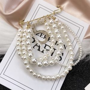 เข็มกลัดติดหน้าอกสไตล์ชาแนลเกาหลีสำหรับผู้หญิงเครื่องประดับแนววินเทจตราไข่มุกเข็มกลัดติดเสื้อโค้ทหรูหราเข็มกลัดติดหน้าอกเรียบหรูสำหรับคาร์ดิแกน