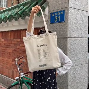 Runpee- J056 กระเป๋าผ้าลาย The good liar กระเป๋าเกาหลี So cute สุดๆ รุ่นไม่มีซีป มีช่องกระเป๋าด้านใน