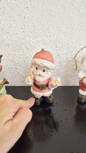 Precious Moments Santa Claus holding a plate of cookies