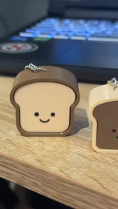 Bread-shaped keychains with smiling faces