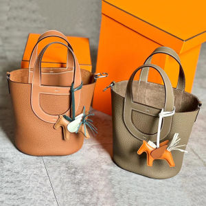 New 2025 Pig Nose Basket Bag Togo Top Layer Cowhide Large Capacity Handheld Water Bucket Commuter Womens Bag Soft Handle