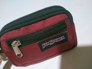 Compact wallet coinpurse with 2 main zippers and a front pocketatm compartment built for style and convenience and handy strap.
