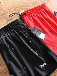 กางเกงขาสั้นชายผ้าไนลอนระบายอากาศได้ดีแห้งเร็ว กางเกงขาสั้นชายหาดสไตล์ลำลองสำหรับฤดูร้อน ทรงหลวม สไตล์เยาวชน