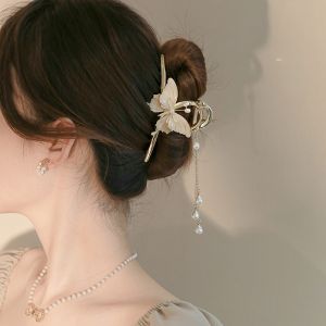 Fairy Butterfly Tassel Grip Hair Clip Hairpin for Women Girls HAIR Extension Clamp Hair Accessory\\n\\n What is a Fairy Butterfly Tassel Grip Hair Clip?\\n\\nThe Fairy Butterfly Tassel Grip Hair Clip is a hair accessory designed for women and girls, specifically for hairstyling purposes. This unique hair clip combines elegance and functionality, making it a popular choice among those who appreciate both style and practicality.\\n\\n Material & Processing Technology\\n\\nCrafted from high-quality alloy material, the Fairy Butterfly Tassel Grip Hair Clip is built to last. The clip undergoes electroplating processing technology, giving it a sleek and polished appearance that enhances its overall aesthetic appeal.\\n\\n Color & Style\\n\\nAvailable in Butterfly Pearl Tassel - Gripper Clip, this hair clip features a combination of butterfly and dragonfly elements, giving it a New Chinese Style appearance. This stylish design makes it a popular choice among women who appreciate personalized trends and animal-themed accessories.\\n\\n Target Audience\\n\\nThe Fairy Butterfly Tassel Grip Hair Clip is designed specifically for women who value both style and functionality in their hair accessories. This versatile hair clip caters to a wide range of women, from casual everyday wear to special occasions.\\n\\n How to Use the Fairy Butterfly Tassel Grip Hair Clip\\n\\nUsing the Fairy Butterfly Tassel Grip Hair Clip is simple and straightforward. Follow these steps to achieve a perfect hairstyle:\\n\\n Step-by-step Guide\\n\\n1. Gather your hair into a ponytail or desired hairstyle.\\n2. Position the hair clip at the base of your ponytail or desired location.\\n3. Press down firmly on the clip to secure your hair in place.\\n\\n Tips for Styling\\n\\nTo achieve the best results with your Fairy Butterfly Tassel Grip Hair Clip, consider these styling tips:\\n\\n* Experiment with different hairstyles, such as braids, half-up/half-down styles, or loose waves.\\n* Pair the hair clip with other accessories, like headbands or hair ties, for a more polished look.\\n* For added volume, tease your hair slightly before securing it with the hair clip.\\n\\n Maintenance & Care\\n\\nTo ensure the longevity of your Fairy Butterfly Tassel Grip Hair Clip, follow these care instructions:\\n\\n* Clean the clip regularly with a soft cloth to remove any dirt or debris.\\n* Avoid exposing the clip to extreme temperatures or harsh chemicals.\\n* Store the clip in a dry place to prevent rust or tarnish.\\n\\n Why Choose the Fairy Butterfly Tassel Grip Hair Clip?\\n\\nThe Fairy Butterfly Tassel Grip Hair Clip offers several advantages over other hair clips on the market:\\n\\n Unique Design\\n\\nWith its butterfly and dragonfly elements, this hair clip stands out from the crowd. Its New Chinese Style appearance adds a touch of elegance and personalization to any hairstyle.\\n\\n Durability & Reliability\\n\\nCrafted from high-quality alloy material and treated with electroplating processing technology, the Fairy Butterfly Tassel Grip Hair Clip is built to last. It provides a secure grip on your hair, ensuring your hairstyle stays in place throughout the day.\\n\\n Versatility & Personalization\\n\\nThe Fairy Butterfly Tassel Grip Hair Clip can be used in various hairstyles, making it a versatile accessory for women. Its unique design allows you to personalize your look and stand out from the crowd.\\n\\nIn conclusion, the Fairy Butterfly Tassel Grip Hair Clip is a must-have accessory for women who value both style and functionality. With its unique design, durability, and versatility, this hair clip is sure to become a staple in your hairstyling arsenal.\n}