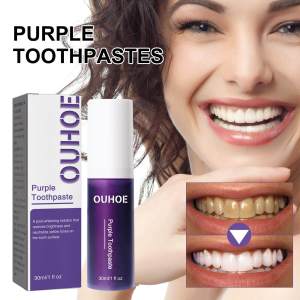 Purple whitening toothpaste cleans teeth stains and protects gums freshens breath and whitens teeth