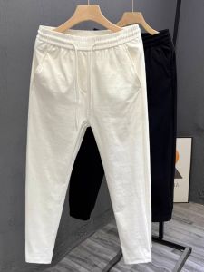 กางเกงลำลองชายทรงสลิมฟิตเอวกลาง กางเกงขายาวทรงบาง ทรงหลวม สไตล์ฤดูร้อน ผ้าฝ้ายผสมโพลีเอสเตอร์ 9 นิ้ว สีพื้น