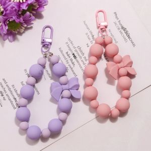 Ngọc Trai Hồng Nơ Móc Khóa Nữ Nhiều Màu Sắc Macaron Đính Hạt Mặt Dây Chuyền Chống Mất Dây Cổ Tay Dây Điện Thoại Cầm Tay