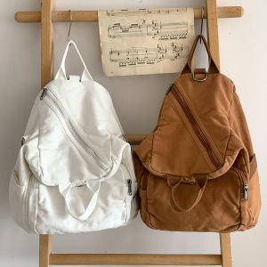 กระเป๋าสะพายข้างผ้าแคนวาสสีบริสุทธิ์ลําลองกระเป๋าสะพายไหล่อเนกประสงค์พร้อมการตกแต่งเข็มขัดสําหรับผู้ชายและผู้หญิง