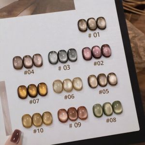 ยาทาเล็บ MlANEL 10 สีน้ำตาล แบบตาแมว พร้อมกาวติดเล็บ ลูกปัดแก้วสีทองใหม่ เคลือบเงาแบบเจลสะท้อนแสง ชุดทำเล็บเจลมืออาชีพครบชุด