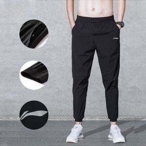 กางเกงวิ่งชาย Li Ning แห้งเร็ว ผ้าไหมน้ำแข็ง ทรงหลวม ทรงตรง ทรงบาง กางเกงวิ่งฤดูร้อน 2022 ทรงปกติ วัสดุโพลีเอสเตอร์