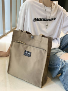 กระเป๋าสะพายผ้าใบความจุขนาดใหญ่สําหรับผู้ชายนักเรียนมัธยมปลายกระเป๋าหนังสือสอนเยาวชน ลำลอง นุ่ม กระเป๋าถือวัสดุไนลอน ซิป ปิด